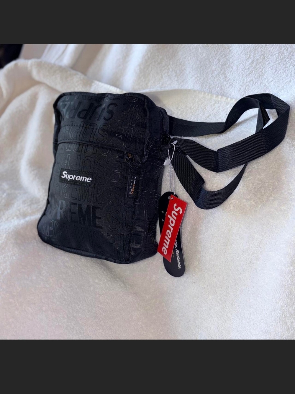 Supreme Black Embossed Logo Shoulder Bag with Red Tag
